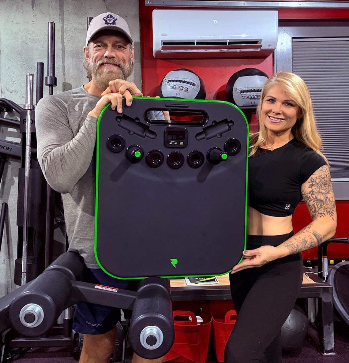 AEW’s Adam Copeland (aka WWE alum Edge) and his wife, WWE alum Beth Phoenix, proudly show Pure Plank, a high-quality, easy to use exercise fitness board for planking.