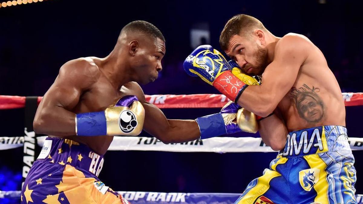 Guillermo Rigondeaux, left, punches Vasyl Lomachenko during their Junior Lightweight bout at Madison Square Garden on Dec. 9, 2017.