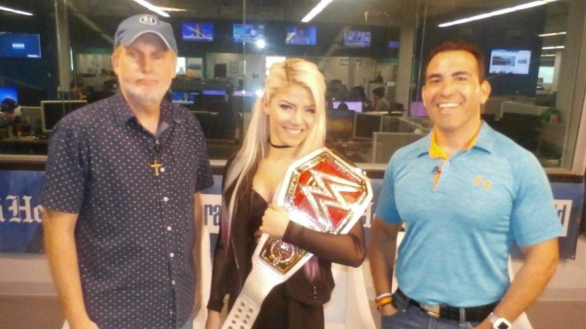 WWE Raw Women’s Champ Alexa Bliss joined Jim Varsallone (pictured left) and Rodolfo Roman for a Miami Herald Facebook Live Q&A on Monday morning. Bliss was in town for WWE Monday Night Raw, which is 8 p.m. ET live on the USA Network from the AmericanAirlines Arena.