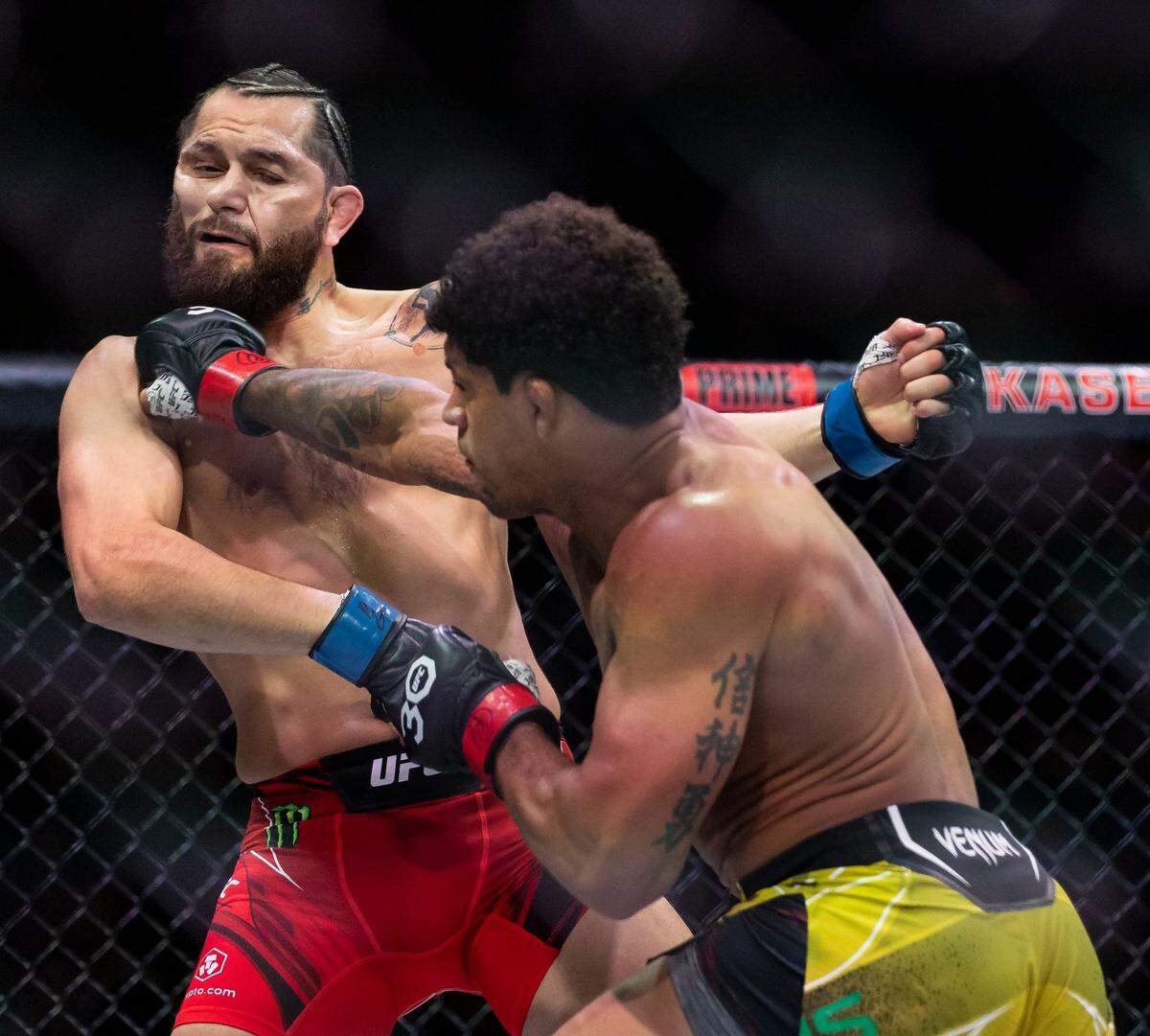 Jorge Masvidal, left, and Gilbert Burns fight in their welterweight title match during the UFC 287 event at the Kaseya Center on Saturday, April 8, 2023, in downtown Miami, Fla.