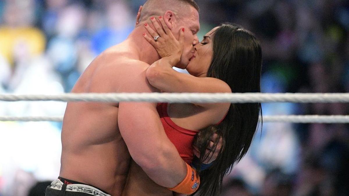 WWE Superstars John Cena, left, and Nikki Bella kiss after she accepted his marriage proposal during WrestleMania 33 on Sunday, April 2, 2017, in Orlando, Fla.