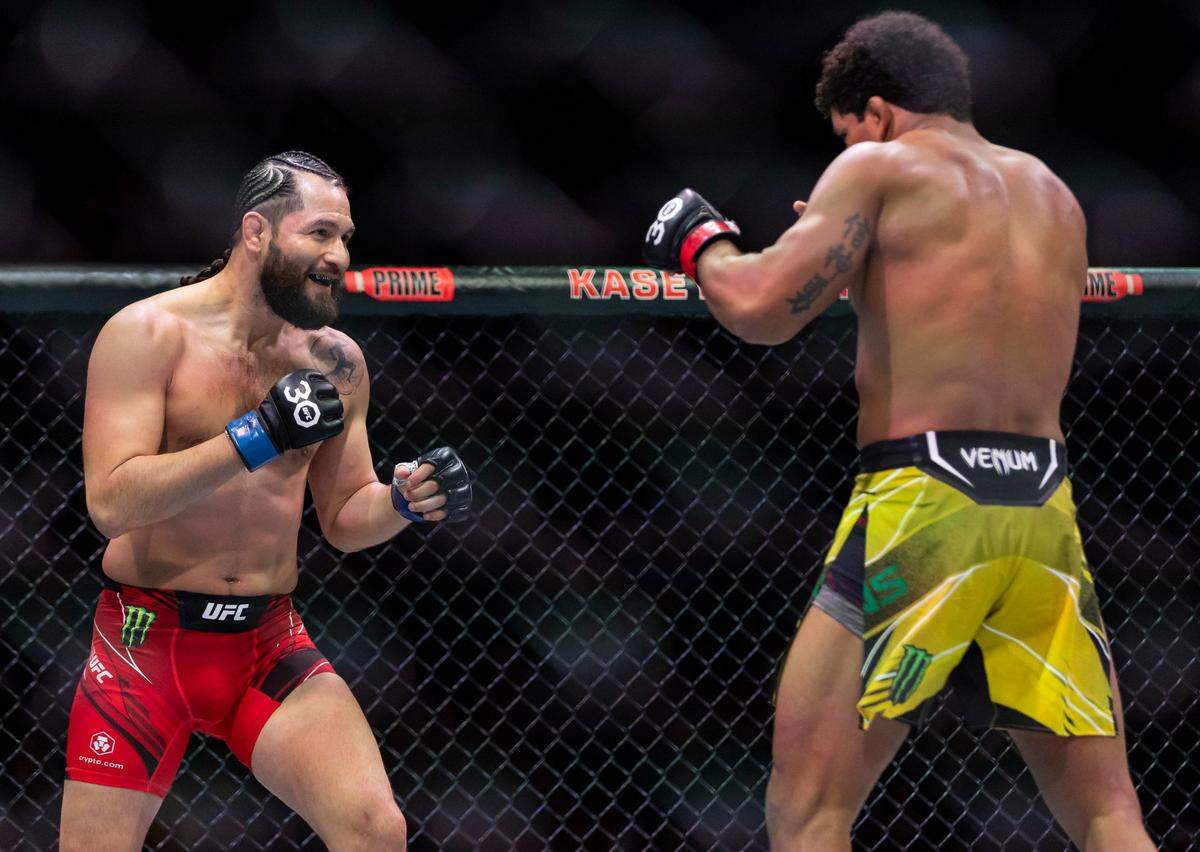 Jorge Masvidal, left, and Gilbert Burns fight in their welterweight title match during the UFC 287 event at the Kaseya Center on Saturday, April 8, 2023, in downtown Miami, Fla.