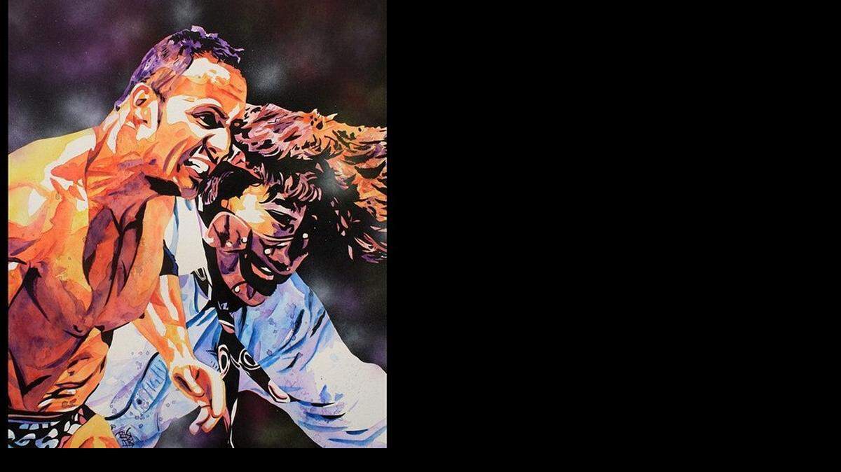 
Artist Rob Schamberger captures the Rock-n-Sock Connection (The Rock and Mankind) on another canvas. 
