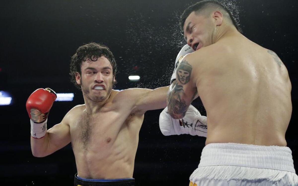 
Julio Cesar Chavez Jr., left, and Bryan Vera, right, during a 12-round super middleweight bout, Saturday, March 1, 2014, in San Antonio.
