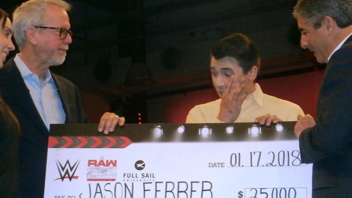 Full Sail University student Jason Ferrer received a $25,000 scholarship from WWE to acknowledge his hard work while commemorating the 25th anniversary of Monday Night Raw. The surprise ceremony was Wednesday, Jan. 17 at the WWE Performance Center in Orlando. Pictured with Ferrer are WWE Assistant Head Coach/Producer Sara Amato (far left), Full Sail University President Garry Jones (second from left) and WWE Executive Vice President of Special Events John Saboor.