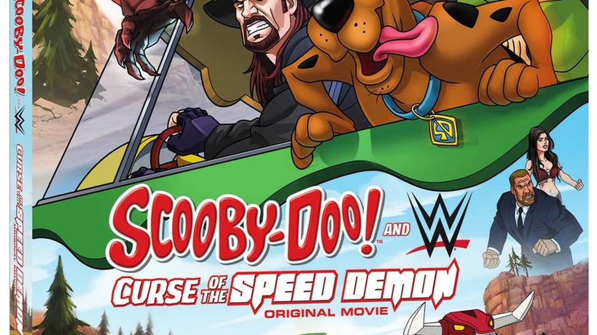 The all-new animated film, Scooby-Doo and WWE: Curse of the Speed Demon, co-produced by WWE Studios, Warner Bros. Home Entertainment and Warner Bros. Animation, will be available on Blu-Ray Combo Pack, DVD and Digital HD for $24.98/$19.98/$19.98 SRP on Aug. 9, just in time for WWE SummerSlam. The star-studded voice cast includes WWE Superstars The Undertaker, Triple H, Paige, Sheamus, Mr. McMahon, Stephanie McMahon, Lana, Rusev, The Miz, Kofi Kingston, and Goldust.