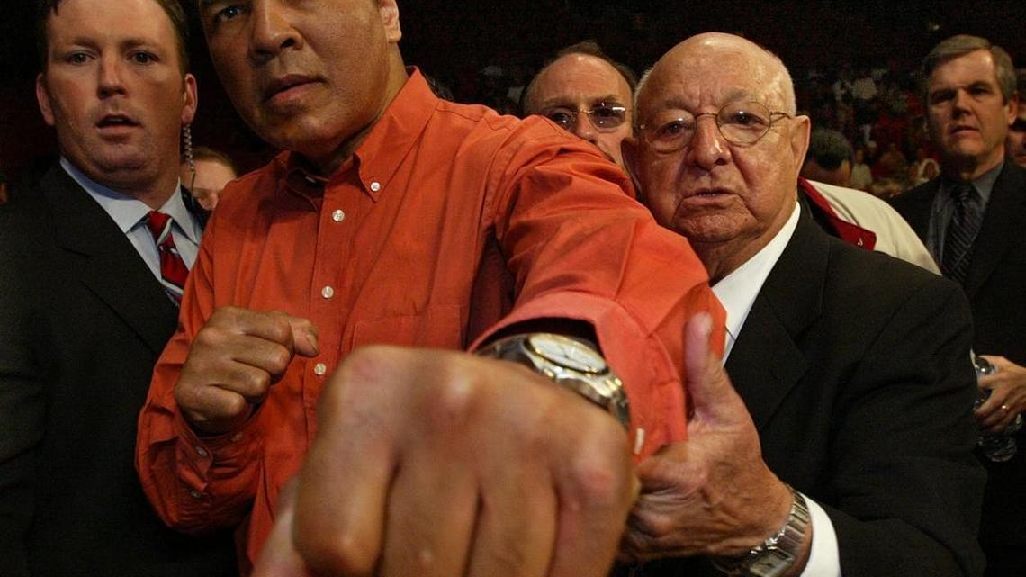 Muhammad Ali attends a Friday Night Fights event to honor his former trainer Angelo Dundee at the AmericanAirlines Arena in Miami on Dec. 21, 2002.