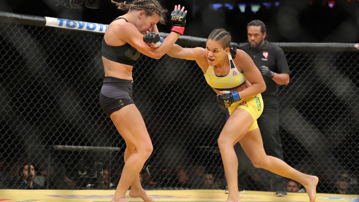 Amanda Nunes of American Top Team in (South Florida) Coconut Creek punches Miesha Tate during the UFC 200 main event at T-Mobile Arena on July 9, 2016 in Las Vegas. Nunes beat Tate to become the new UFC women’s bantamweight champion.