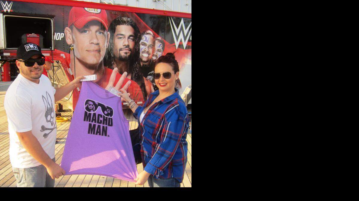 
Ubaldo Ubi Hernandez of Doral was one of two grand prize winners, winning a Macho Man Randy Savage jersey and two ringside tickets to WWE SmackDown -- courtesy of WWE through a Miami Herald contest -- on Tuesday, Feb. 17 at the BB&T Center in Sunrise, near Fort Lauderdale. Hernandez, pictured with Jessica Cespedes, also received complimentary club parking, courtesy of the BB&T Center. The contest encouraged fans to send a photo or video, impersonating the late, great Macho Man Randy Savage, a 2015 WWE Hall of Famer.
