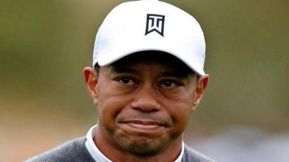 
Tiger Woods grimaces after finishing the ninth hole during the second round of the Phoenix Open golf tournament, Friday, Jan. 30, 2015, in Scottsdale, Ariz. 
