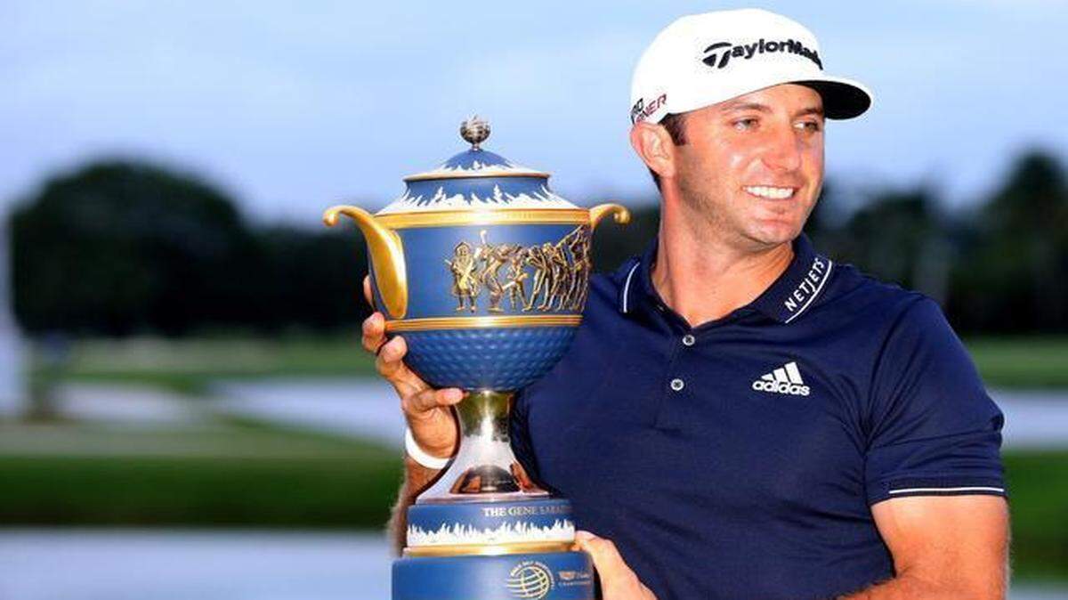 
Dustin Johnson holds the Gene Sarazen Cup after winning in the final round of the WGC-Cadillac Championships at Trump National Doral, in Doral, Florida on March 8, 2015.
