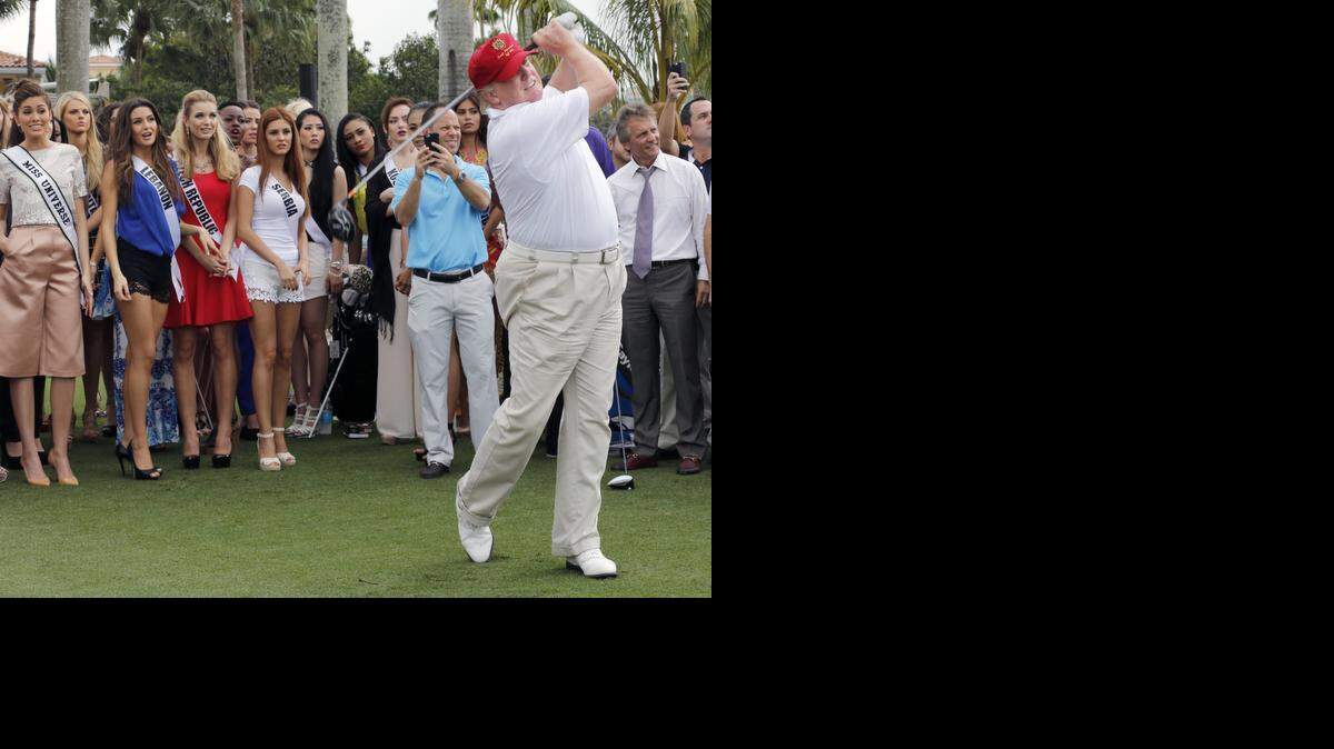 
Donald Trump, right, tees off on the Red Tiger golf course. Miss Universe contestants along with Donald Trump teed off on the newly renovated "Red Tiger" golf course at Trump International Doral Miami on Monday, January 12, 2015.
