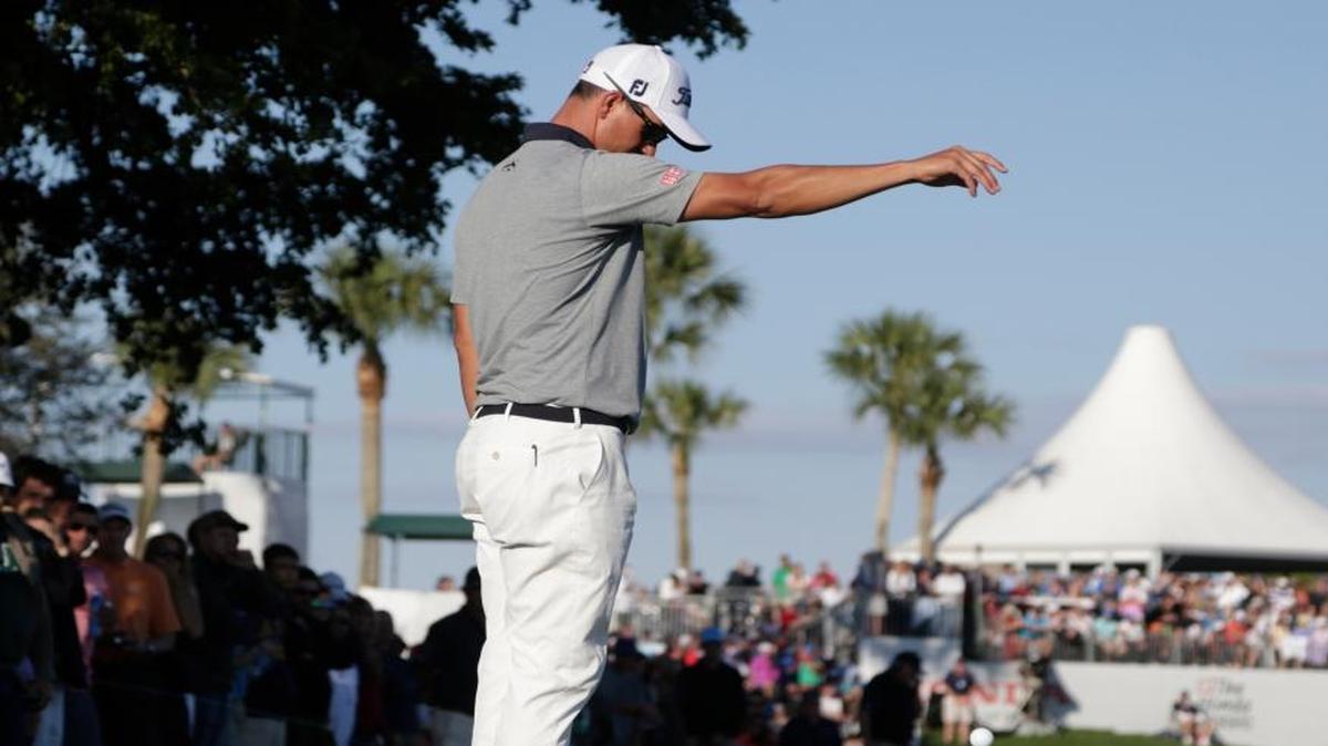 Adam Scott, of Australia, takes a drop after hitting into the water on the 15th hole during the third round of the Honda Classic golf tournament, Saturday, Feb. 27, 2016, in Palm Beach Gardens.
