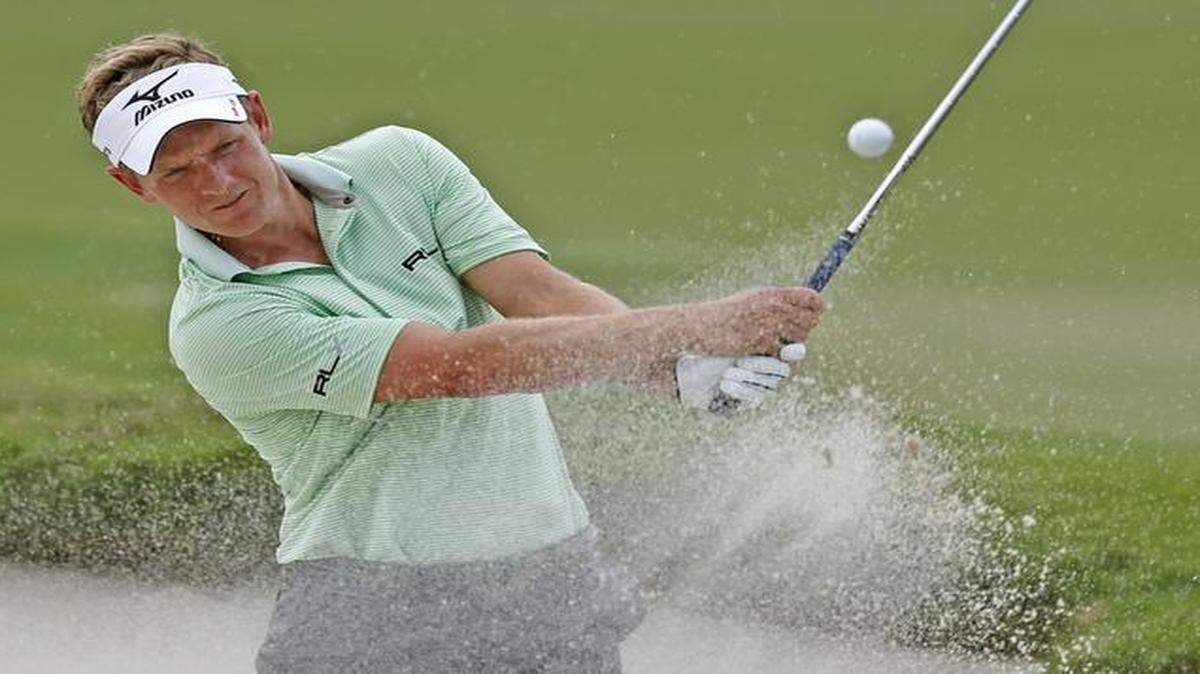 
Luke Donald hits out of a bunker during a practice round for the WGC-Cadillac Championship at Trump National Doral on Wednesday, March 4, 2015.
