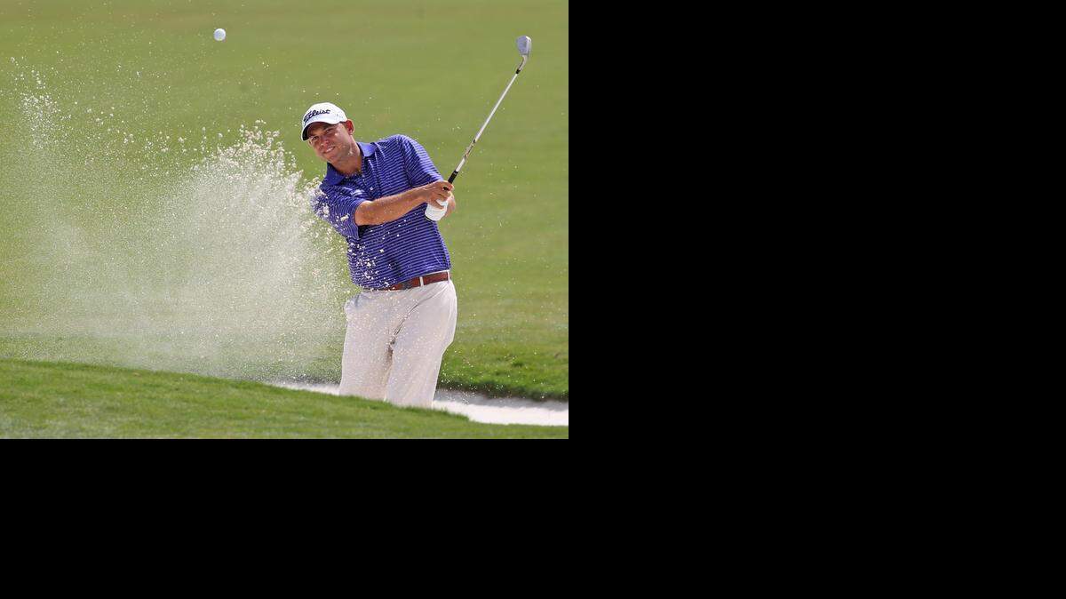 
Bill Haas in the bunker at the first hole during the first round of the World Golf Championship-Cadillac Championship at Trump National Doral in Doral on March 6, 2014.
