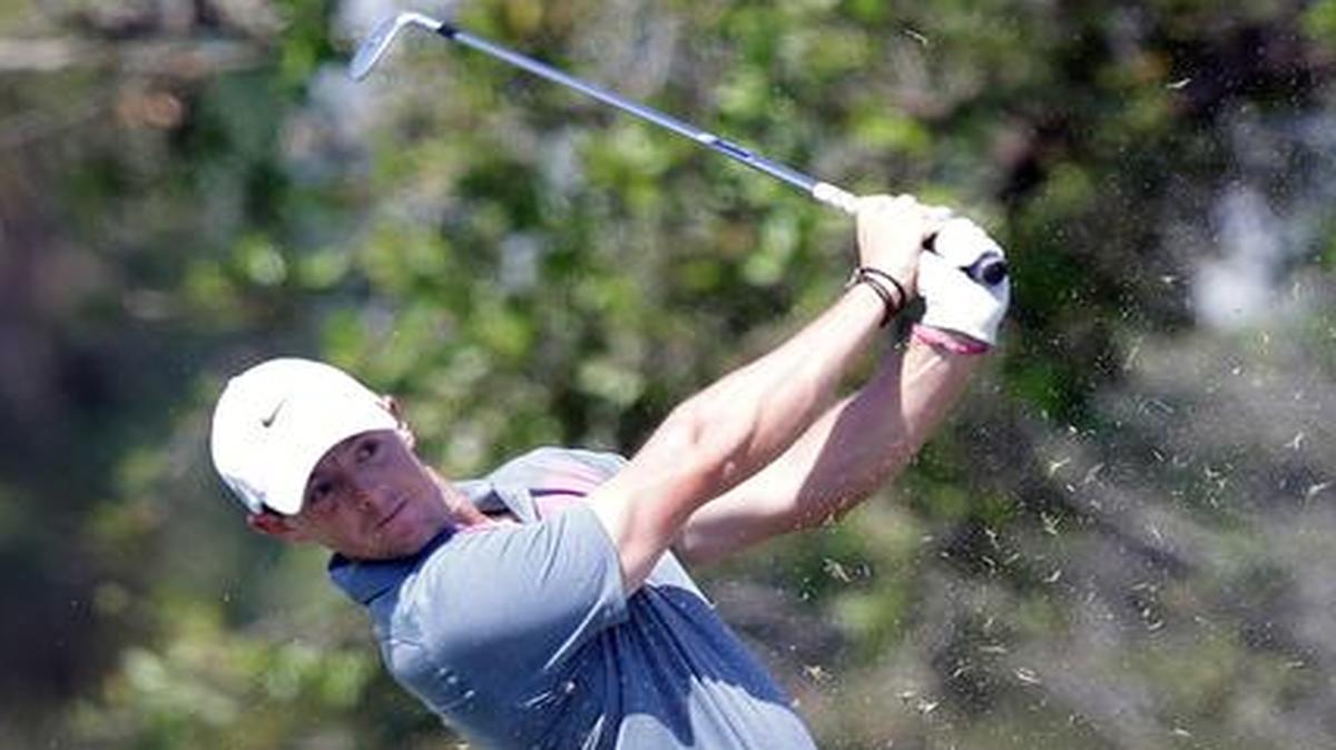 
Rory McIlroy, shown hitting an approach on No. 6, tossed his 3-iron into the lake on No. 8 after hitting an approach shot into the water Friday, March 6, 2015 at the WGC-Cadillac Championship at Trump National Doral.
