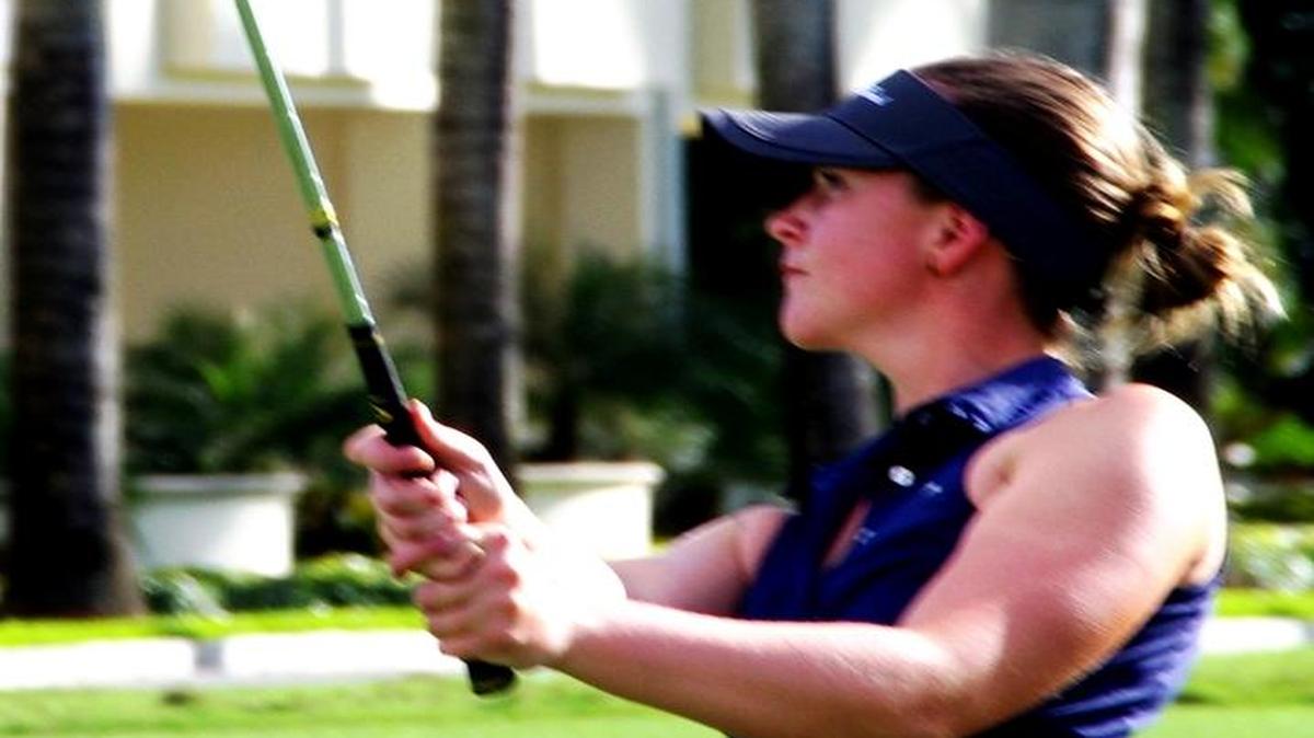 Linn Grant of Sweden smacks an iron approach shot on No. 18.