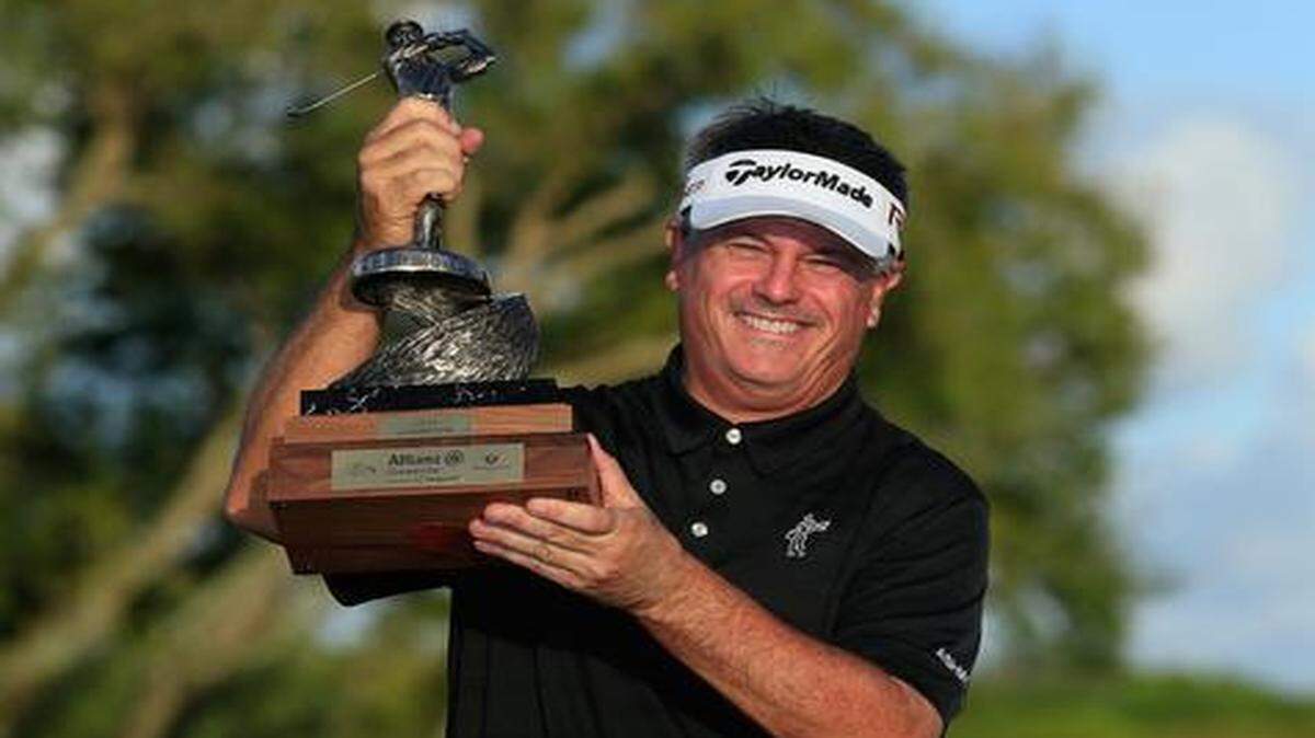 
Paul Goydos holds the trophy after winning the Allianz Championship on Sunday at The Old Course at Broken Sound in Boca Raton.

