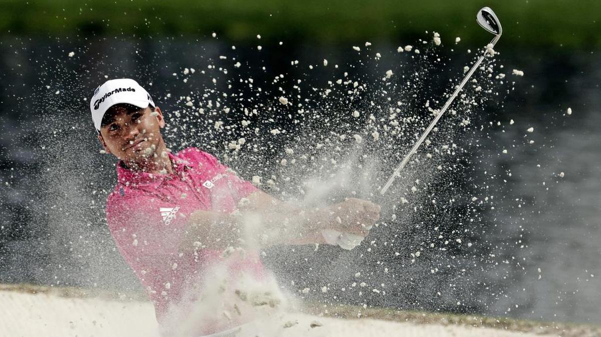 Jason Day, of Australia, hits out of a bunker on the sixth hole during the par three competition at the Masters golf tournament Wed., April 6, 2016, in Augusta, Ga.