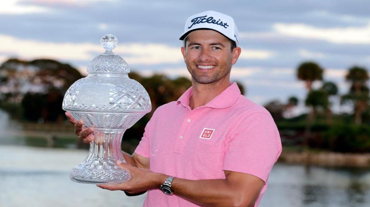 Adam Scott holds the trophy after winning the Honda Classic with a final-round even-par 70 on the Champion Course at PGA National.