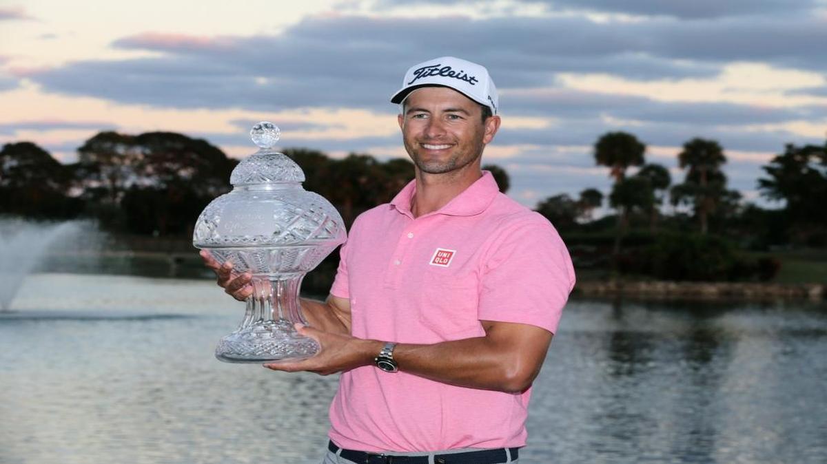 Adam Scott, of Australia holds the trophy after winning the Honda Classic golf tournament with a 9-under-par, Sunday, Feb. 28, 2016, in Palm Beach Gardens.