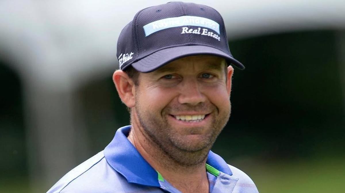 Erik Compton, shown smiling as he makes his way to the ninth green during the first round of the Wyndham Championship golf tournament on Thursday, Aug. 20, 2015, in Greensboro, N.C., shot a 68 in the first round of the Honda Classic on Thursday, Feb. 25, 2016.