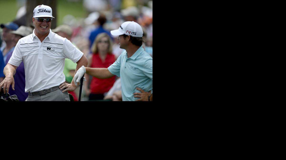 
Charley Hoffman, left, and Brian Harman relax at the 17th tee box during second-round action of the Masters on Friday, April 10, 2015 in Augusta, Ga. 
