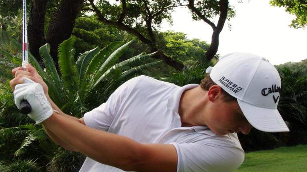 
Giovanni Tadiotto takes a full iron swing Sunday the Biltmore Golf Club in Coral Gables.

