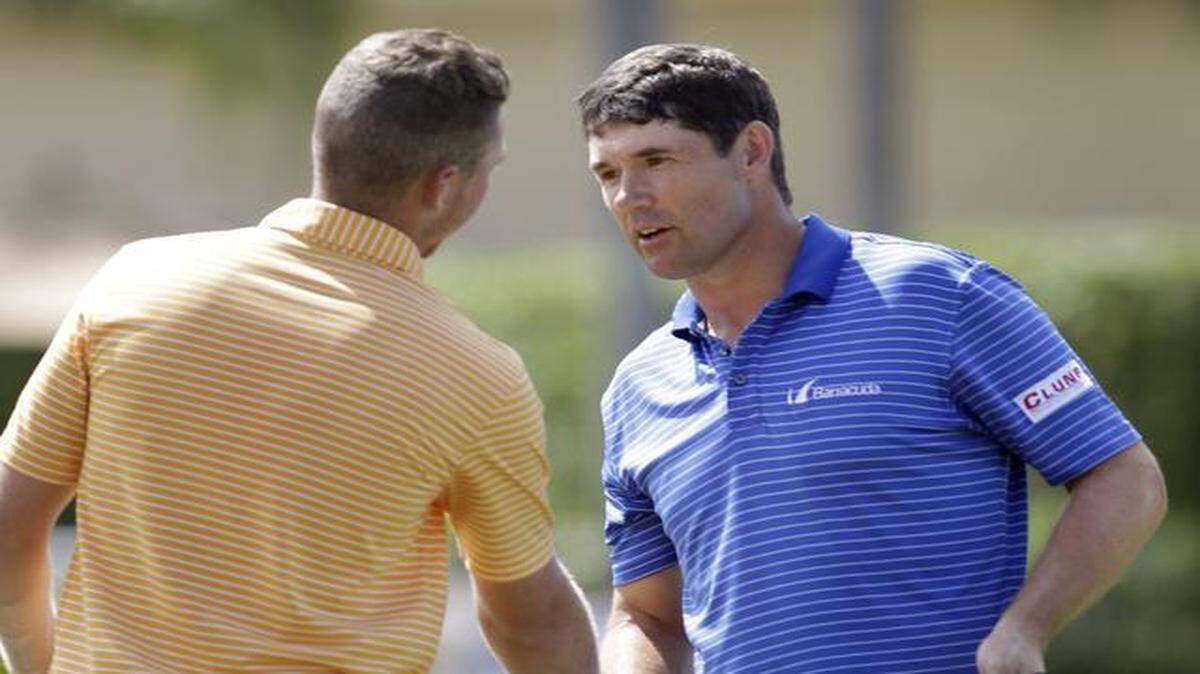 
Padraig Harrington, right, shakes hands with Daniel Berger after winning the Honda Classic on No. 17, the second hole of a playoff.

