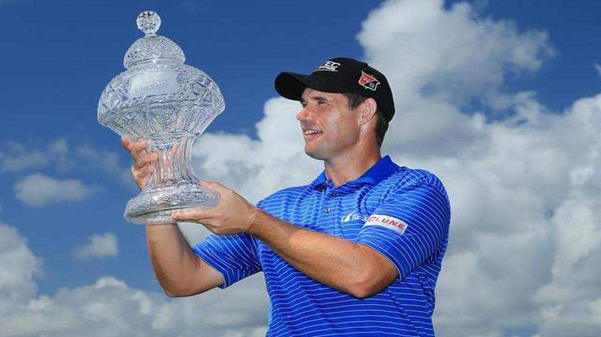 
Padraig Harrington, 43, who hadn’t won on the PGA Tour in more than six years, holds the Honda Classic trophy after his victory at PGA National Resort & Spa on Monday morning.
