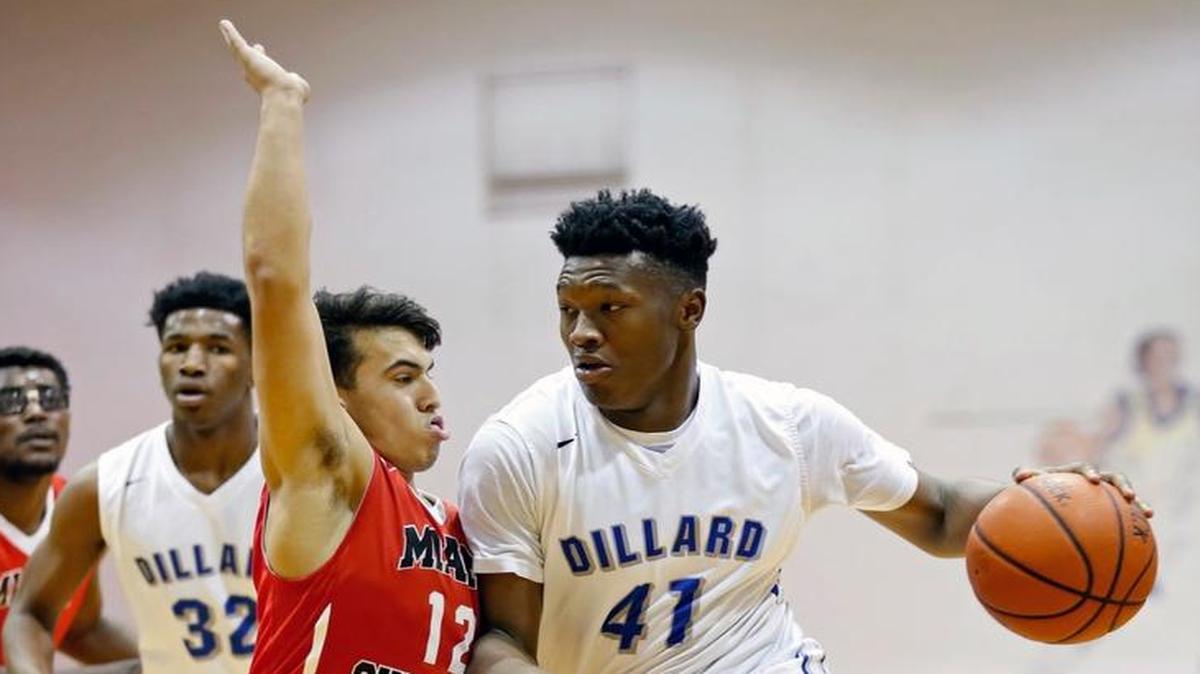 Dillard's Raiquan Gray (41) drives the ball around Miami Christian's Jordan Hamburger (12) during the MLK Basketball Classic high school basketball game between Dillard and Miami Christian at Coral Springs Arena on Saturday, Jan. 16, 2016.