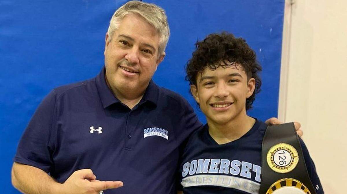 Somerset-Pembroke Pines wrestling coach Joe Blasucci with Matthew Velasco at the Seahorse Open.