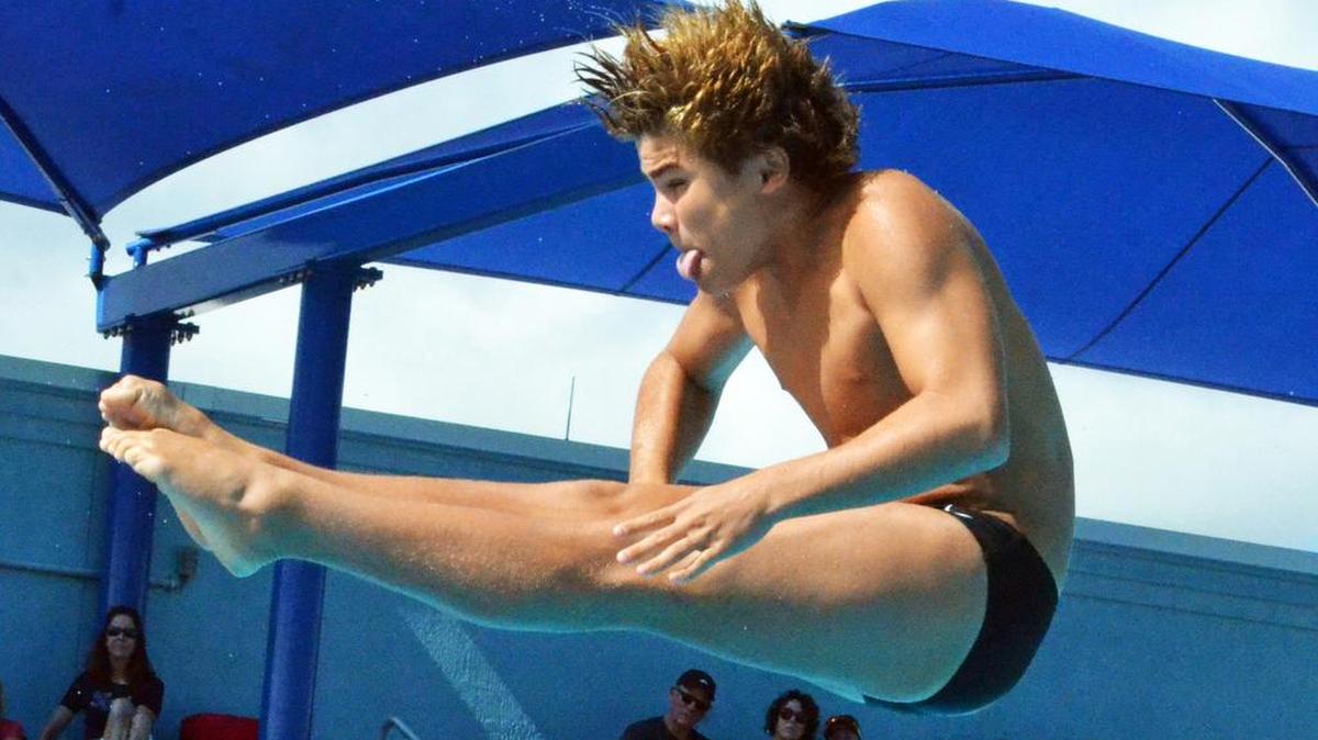 Pine Crest eighth-grader Kevin Mendez spins through the air during the FHSAA Class 1A diving state finals on Saturday at Sailfish Splashpark Aquatic Center in Stuart.