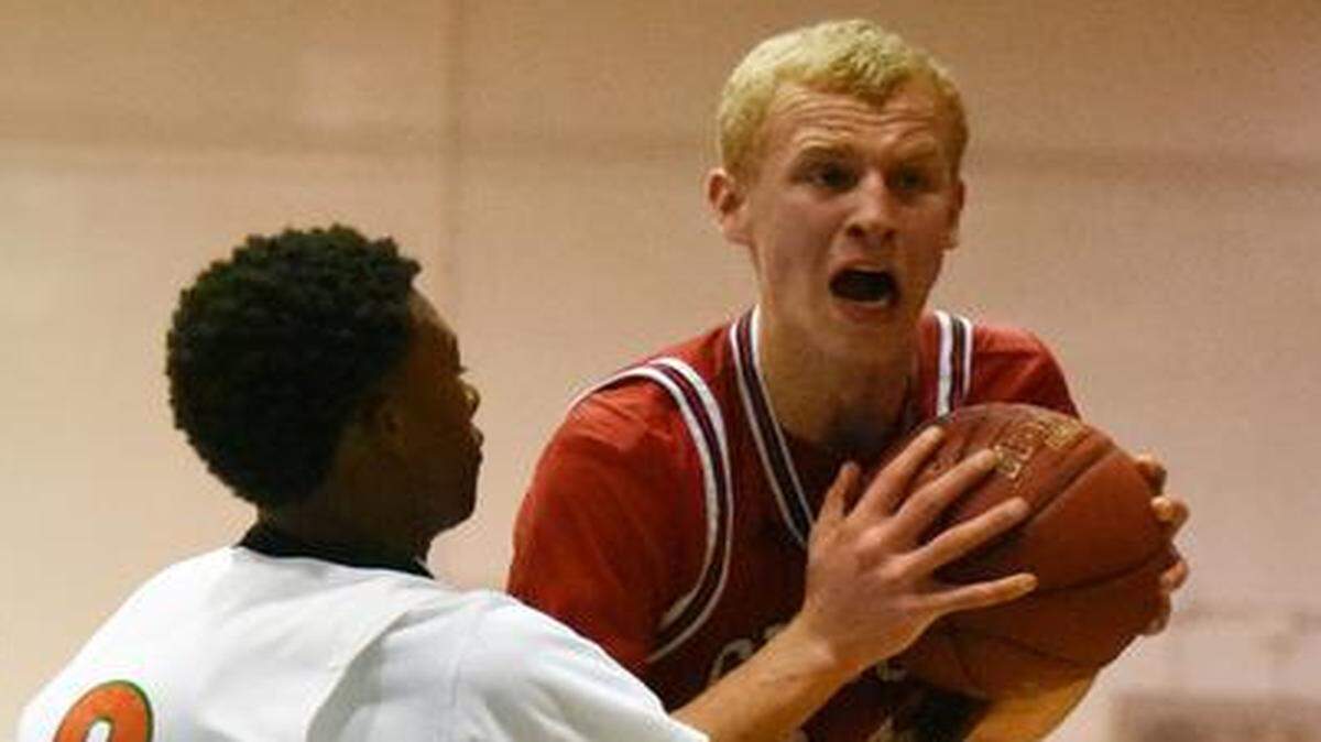 
Maverick Rowan, shown against Ely earlier this season, finished with a game-high 34 points, nine rebounds and two steals to help Cardinal Gibbons rout St. Petersburg Gibbs in a state semifinal Friday, Feb. 27, 2015. 
