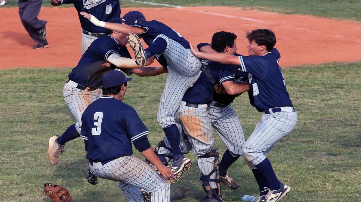 Columbus players celebrate their 2-1 victory over Coral Park after the finsih of a high school playoff game between Columbus and Coral Park on Tues., May 10, 2016.