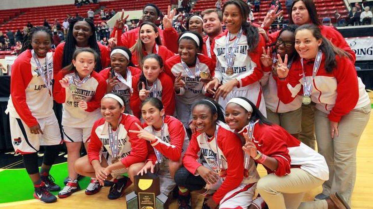 
Miami Country Day celebrates its state title after defeating Seffner Christian Academy 77-59 in the FHSAA Girls 3A basketball championship at The Lakeland Center on Wednesday, Feb. 18, 2015 in Lakeland. 
