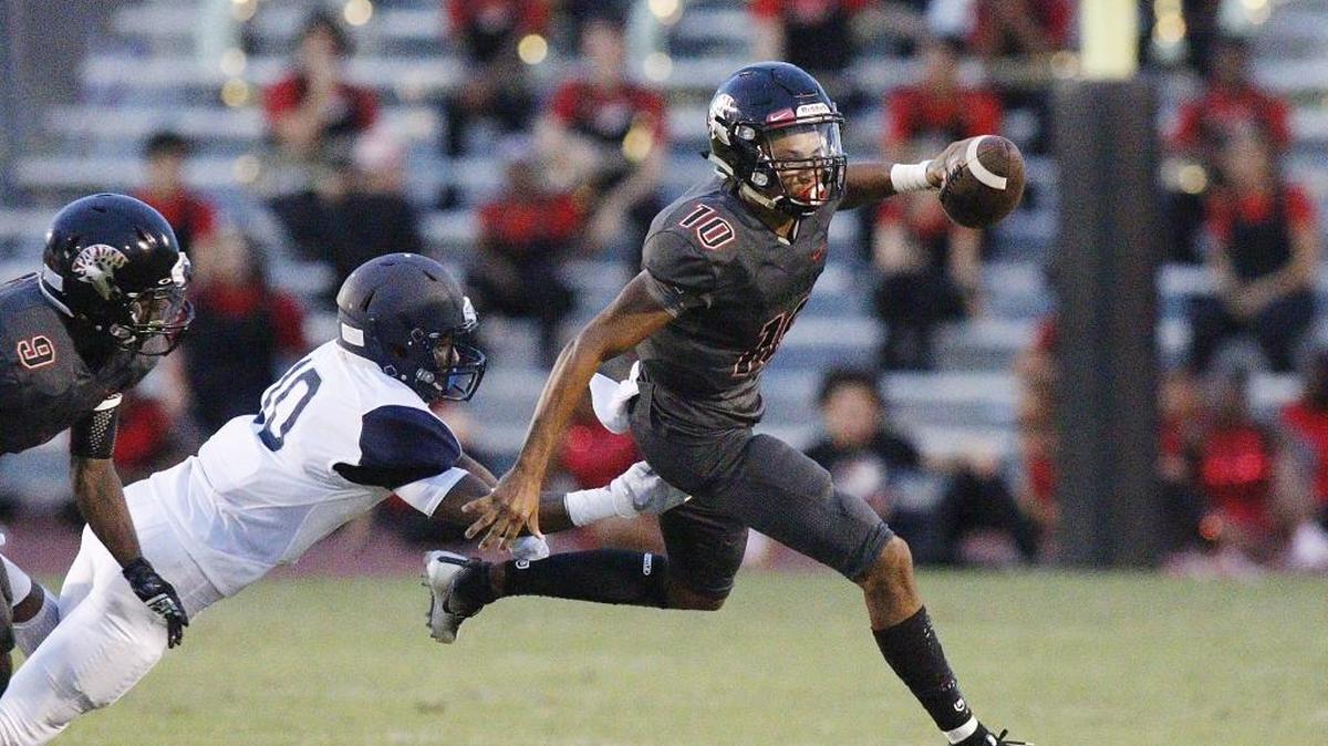 Southridge Spartans quarterback Michael Cox (10) runs the ball against the Palmetto Panthers during their game on Sept. 22, 2017 at Miami Southridge Senior High School.