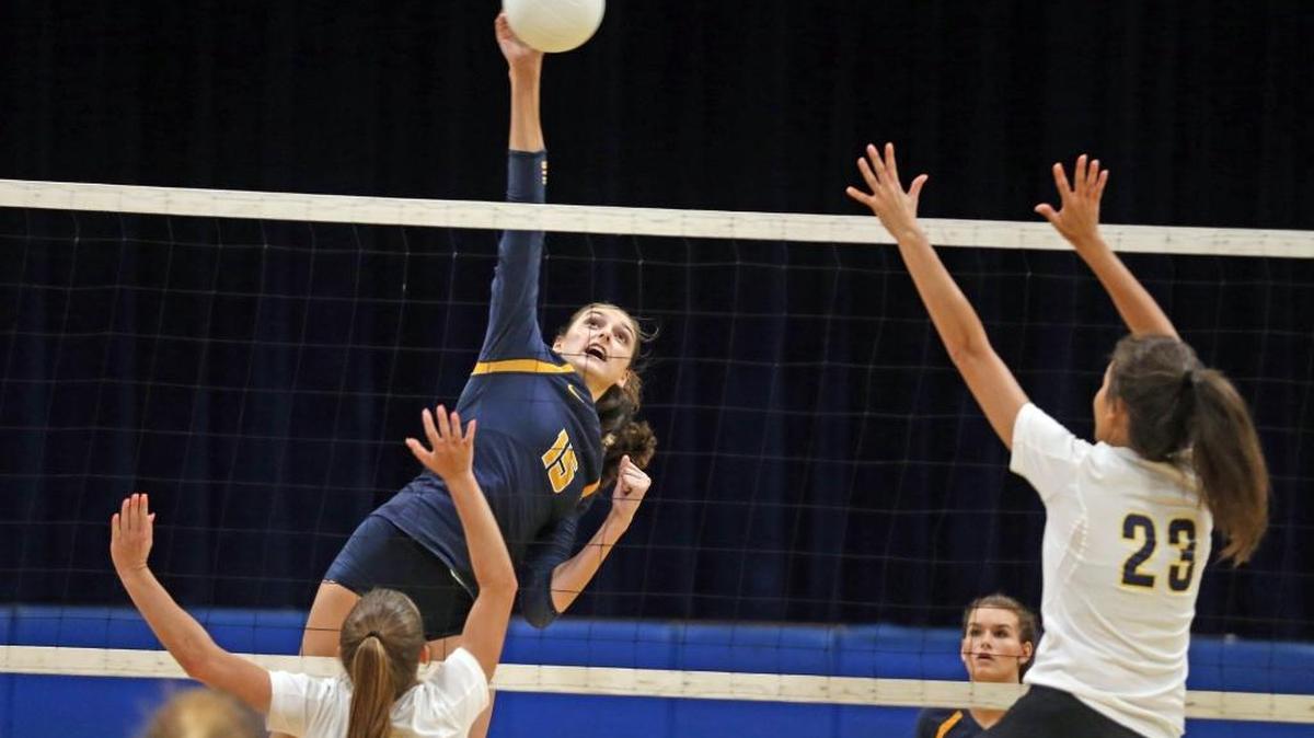 Saint Thomas Aquinas HS Sophia Davis (15) hits the ball over the net as they played Pompano Beach HS in the BCAA Big 8 at Pompano Beach HS, October 11, 2017.