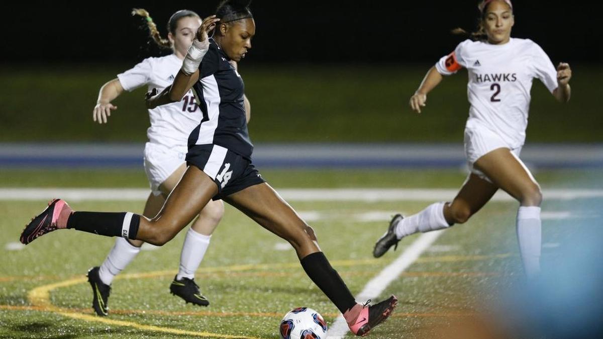Coral Reef’s Rayquel Berry (14) scoress against Miami Springs’ during the GMAC girls' soccer championship on Jan. 13, 2017.
