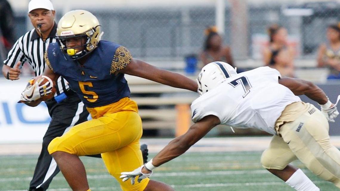 St. Thomas Aquinas Riders running back Daniel Carter (5) carries the ball against St. John Bosco during their football game on Friday, August 25, 2017 at St. Thomas Aquinas High School in Fort Lauderdale.