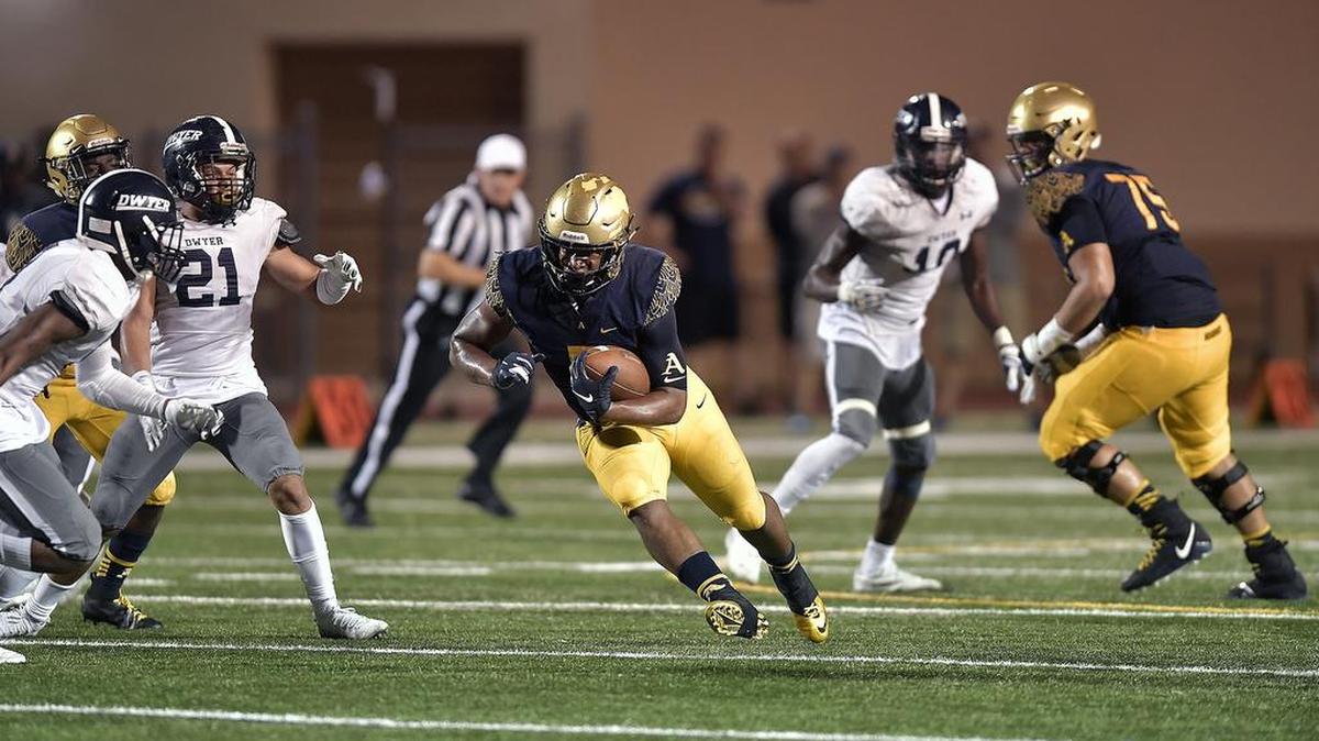 St. Thomas Aquinas running back Daniel Carter finds plenty of room to run against the Dwyer defense during the first half of their 7A regional final game, Friday, November 23, 2018. St. Thomas Aquinas won 35-0.
