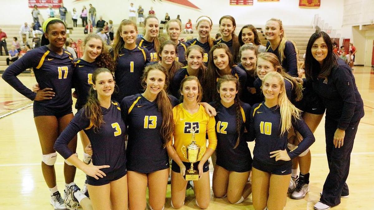 St. Thomas Aquinas girls’ volleyball team poses for a picture after a victory against Cardinal Gibbons in the BCAA Big 8 Tournament championship match Wednesday, Oct. 14, 2015 at Cardinal Gibbons High in Fort Lauderdale.