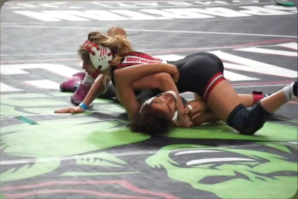 Miami Southridge sophomore Abigail Gonzalez made history by qualifying for the FHSAA boys’ state wrestling tournament in Kissimmee. She placed eighth at state to earn a medal.