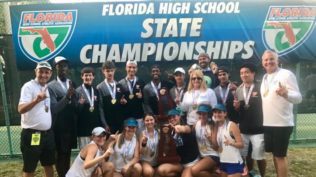 The Palmetto boys’ and girls’ tennis teams celebrate their Class 4A team titles on Thursday.