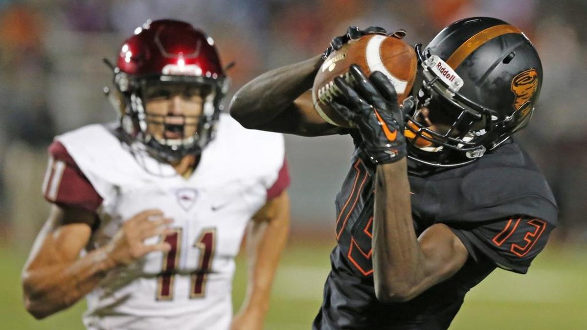
Booker T. Washington’s Corey Hammett grabs a touchdown catch in the second quarter against Citra North Marion at Traz Powell Stadium in a preseason game Friday, Aug. 21, 2015.
