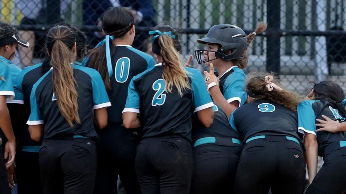 Coral Reef players celebrate Jeniee Casa–as  two runs home run in the second inning of the Coral Reef vs Lourdes Softball game at Palmetto Bay Park, Wednesday, May 02, 2018.