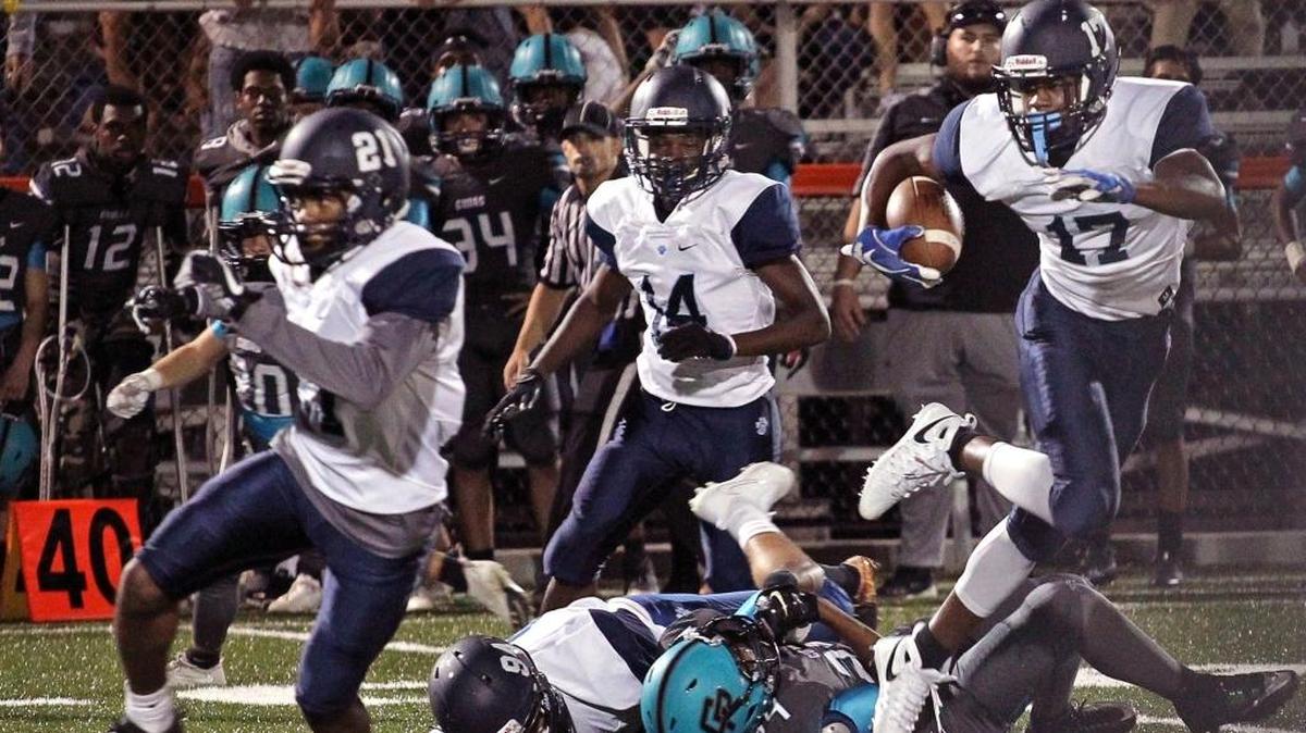 Palmetto's Jason Marshall, #17, right, follow his teammates after intercepting a pass in the first half where Palmetto dominated and did not allow a single touchdown or field goal on Thurs., Nov. 2, 2017. The Panthers won the District 16-8A title.
