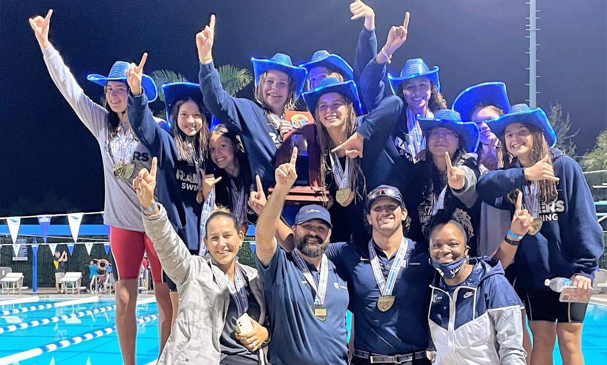 The state champion Gulliver Prep girls’ swimming team.