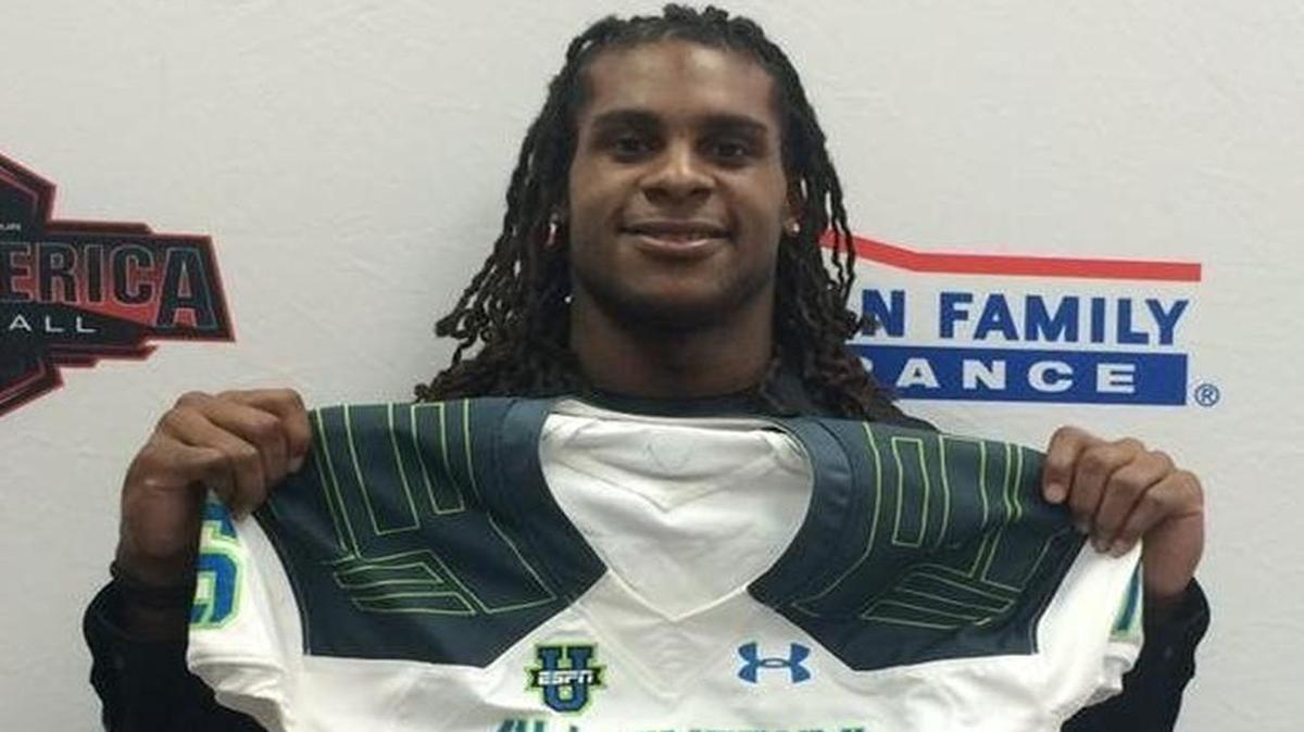 
Gulliver Prep wide receiver and UM commitment Dionte Mullins shows off his Under Armour All America jersey Tuesday, Oct. 13, 2015.
