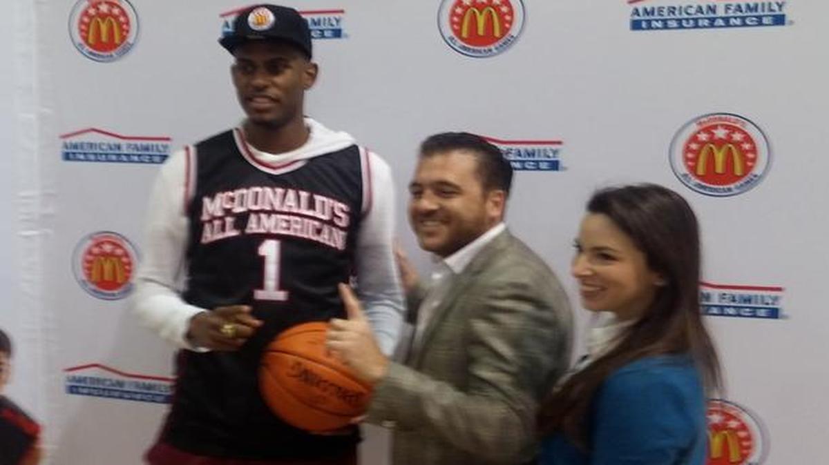 Miami Norland’s Dewan Huell poses for a photo with McDonald’s executives at a news conference Tuesday announcing he was chosen for the McDonald’s All American team.